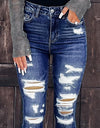 Jeans ajustados rasgados, lavados, con agujeros
